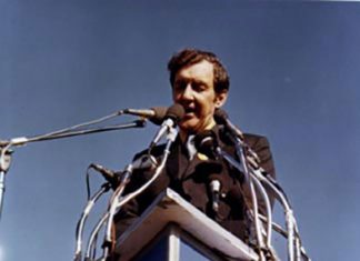 U.S. Senator Edmund Muskie, author of the 1970 Clean Air Act, addressing an estimated 40,000-60,000 people as keynote speaker for Earth Day in Fairmount Park, Philadelphia on April 22, 1970. The image on the podium was the official logo of the first Earth Week. Photo: Wikimedia, CC.