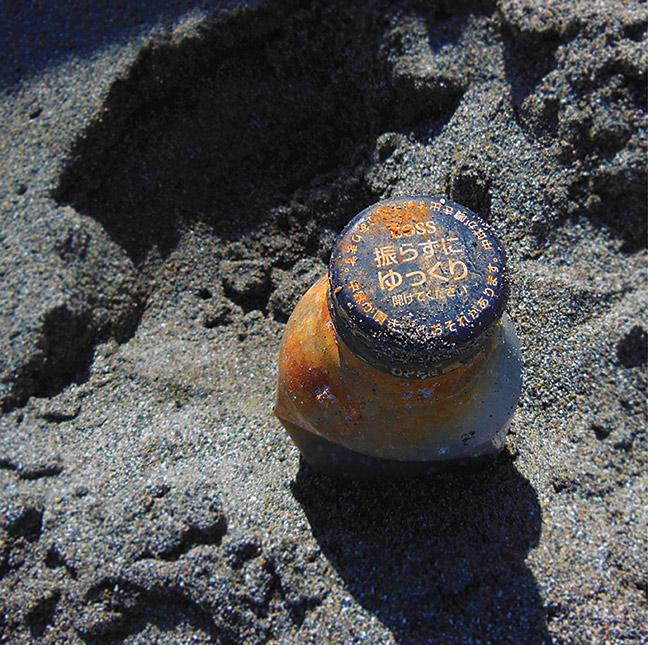 A Japanese bottle washed onto a North Coast beach from the 2011 Tōhoku earthquake and tsunami. Photo: Dan Ehresman.