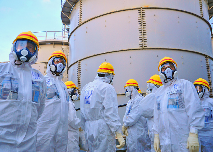 A team of IAEA experts check out water storage tanks TEPCO's Fukushima Daiichi Nuclear Power Station on 27 November 2013. The expert team is assessing Japanese efforts to decommission the stricken nuclear power plant. Photo Credit: Greg Webb / IAEA