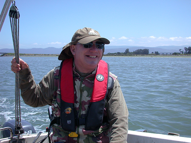 Charlie Butterworth reveling in a sunny day with good company on Humboldt Bay aboard his sailboat, June 2014. Photo: Jennifer Kalt.